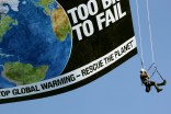 Greenpeace Activists Hang From Banner