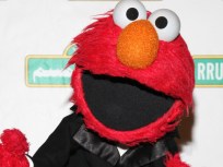 Sesame Creep Elmo Begs Tourists for Cash