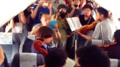 RAW VIDEO: Orchestra Performs on Delayed Plane