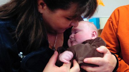 Tiffnie Esquibel kisses her 2-month-old son, Sam, after his physical therapy session at Pediatric Rehabilitation. Sam was born with a rare brain tumor that was removed shortly after his birth Oct. 1, Tiffnie Esquibel kisses her 2-month-old son, Sam, after his physical therapy session at Pediatric Rehabilitation. Sam was born with a rare brain tumor that was removed shortly after his birth Oct. 1,