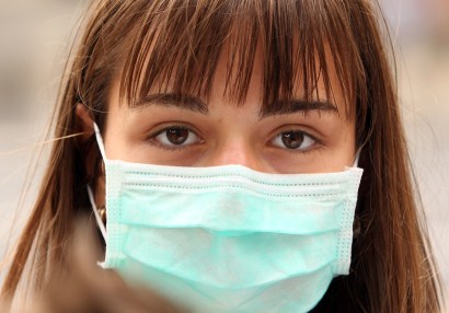 You'll have to take off the surgical mask to get the first vaccine against swine flu -- it will come in the form of a nasal spray.