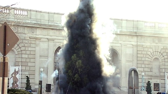 Chinese artist Cai Guo Quiang staged a pyrotechnic Christmas tree lighting outside the Smithsonian Freer Gallery of Art Friday. The smoke that cascaded around the 40-foot-tall tree afterward is meant to mimic the strokes of a traditional Chinese brush drawing.