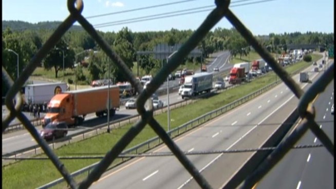 Three people were hospitalized after a wrong-way crash that closed Route 15 in Meriden for hours on Wednesday.