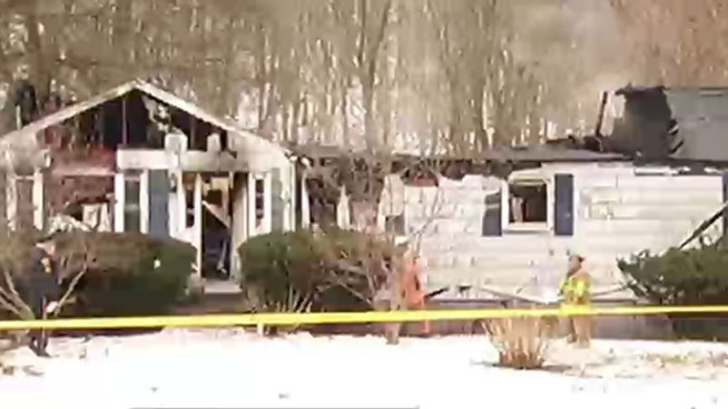 Neighbors said a mother and her two middle-aged sons live in the house and a family member said her step-brother did not make it out of the house.