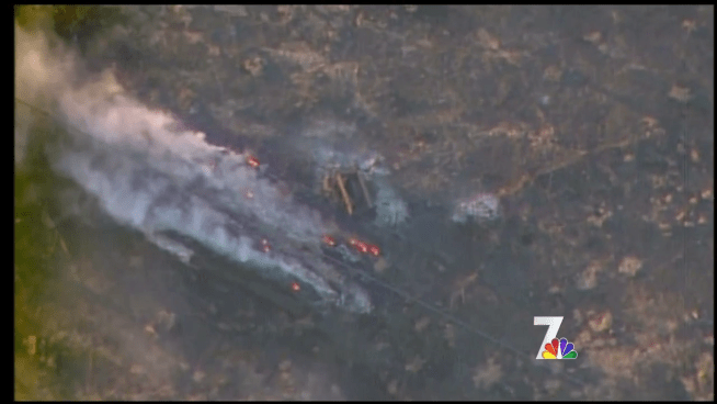 One person has died in a fast-moving brush fire that burned 30 homes near Campo in San Diego's East County.