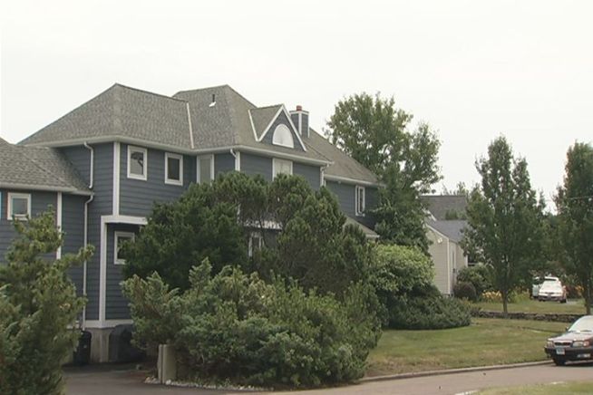 A 25-year-old man is in critical condition after being shot while allegedly invading a Milford home on Saturday night, police said.