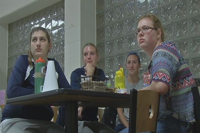 On a big screen inside the dining hall at the University of St. Joseph more than 100 students gathered to watch Mitt Romney and Barack Obama face off in their first debate.