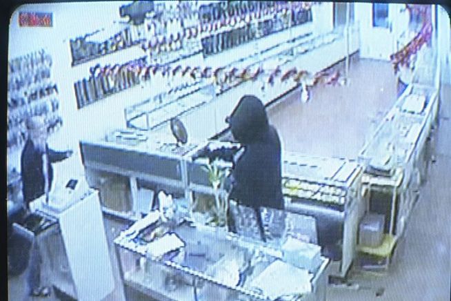 A New Haven, Conn., business owner fought back and held a robbery suspect inside his store until police arrived.