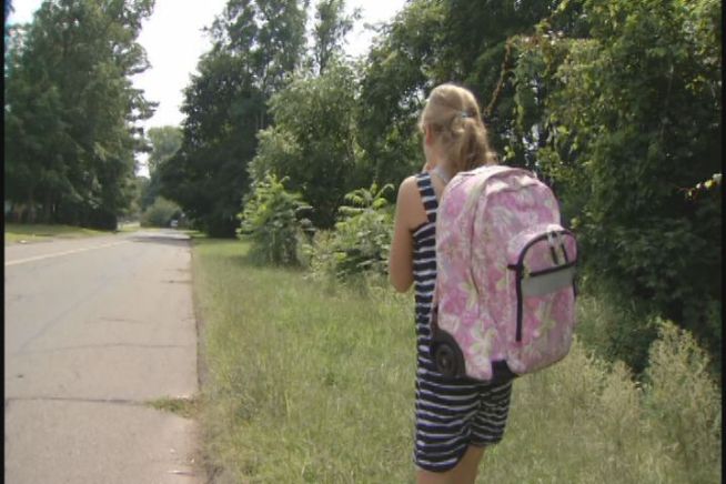 How long is too long a walk to school? One parent says his daughter's school is putting her safety at risk to save some money.