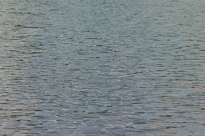 A dispatcher sends an ambulance to a lake for a drowning victim, fearing that the victim might be her brother.