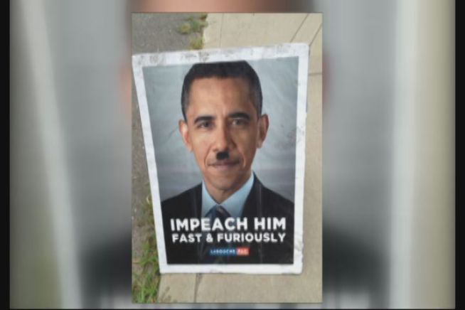 A controversial poster of President Obama led to the arrest of a woman in Hebron.