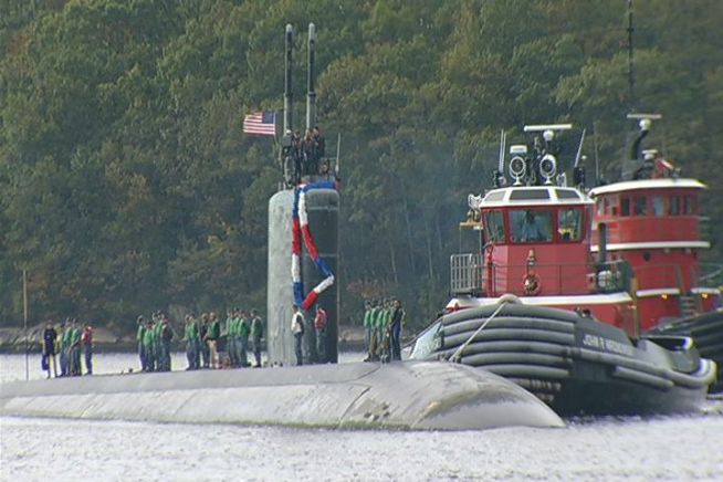 The crew of the  Toledo returned home to Groton today to excited family members