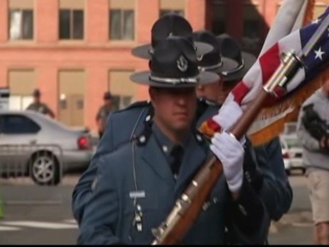The memorial service begins for Connecticut state trooper Hall who was killed in the line of duty.