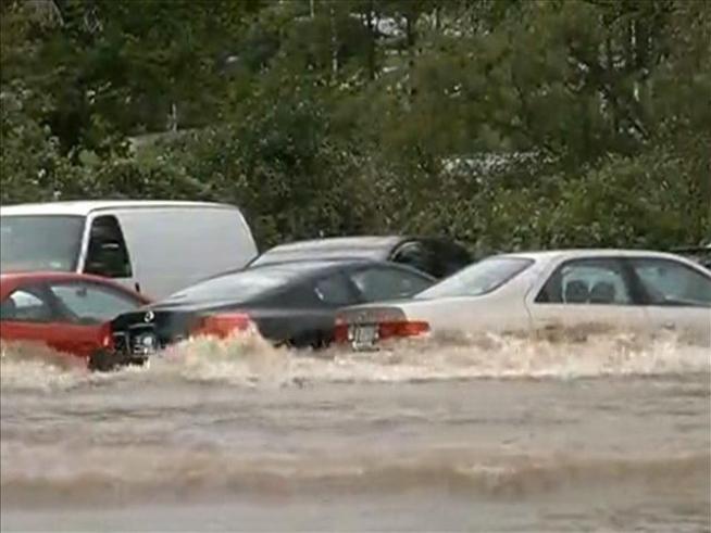 A parking lot is flooded at the University of Hartford.