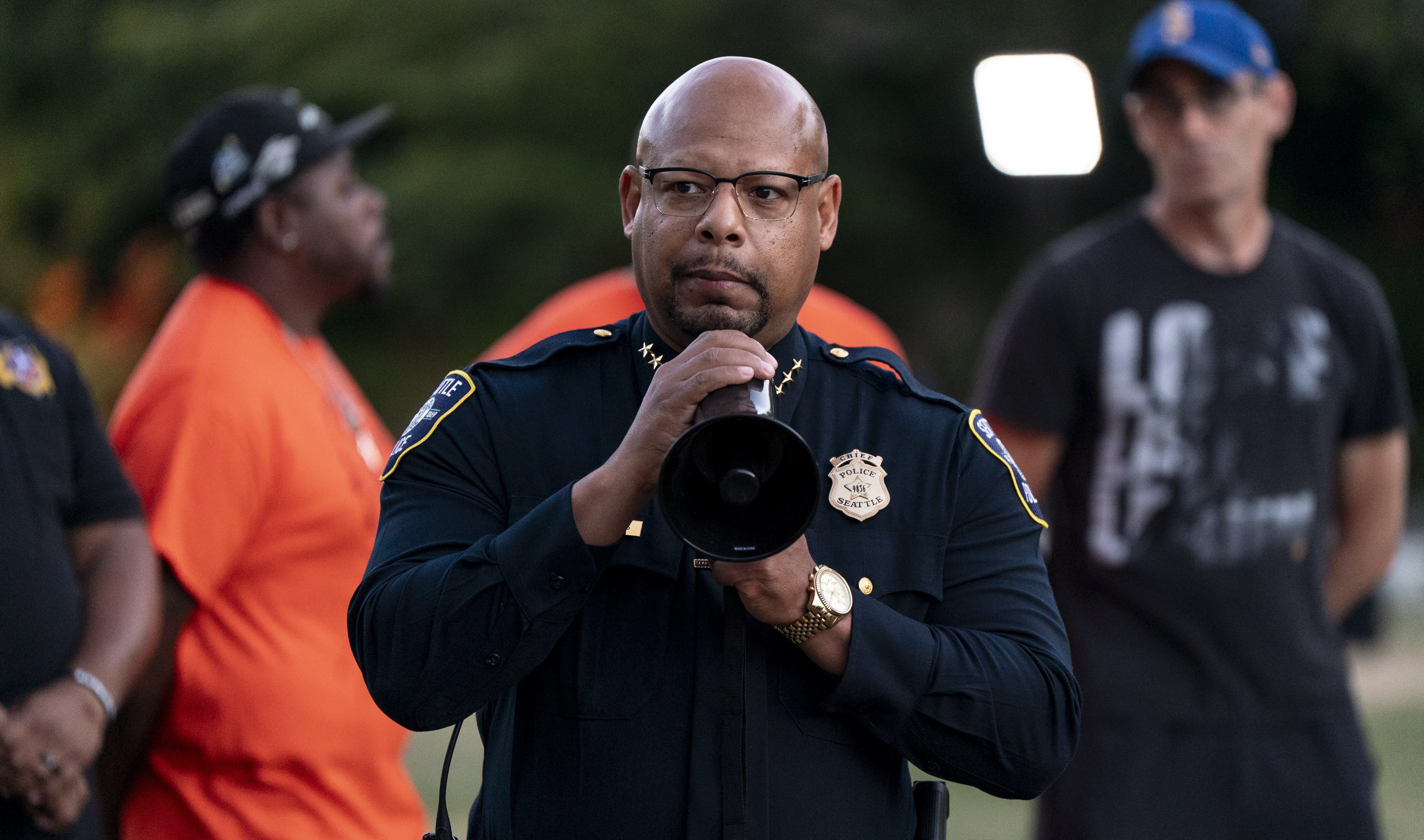 Seattle Police Chief Shon Barnes speaks during a vigil.