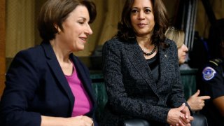 Senators Amy Klobuchar, D-Minn., left, and Kamala Harris, D-Calif., talk