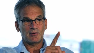 FILE - In this Sept. 17, 2014 file photo, Colorado-based author Jon Krakauer gestures during an interview in Denver. Krakauer has filed suit over a musical adaptation of his 1996 book "Into the Wild." The Boulder Daily Camera reported Friday, Dec. 7, 2018. Krakauer originally agreed to let playwrights Nikos Tsakalakos and Janet Allard use his name and the book title but changed his mind because he objected to their script. (AP Photo/Brennan Linsley, File)