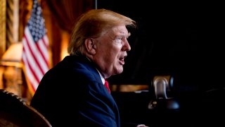 FILE – In this Dec. 24, 2019 photo, President Donald Trump speaks to members of the media following a Christmas Eve video teleconference with members of the military at his Mar-a-Lago estate in Palm Beach, Fla.