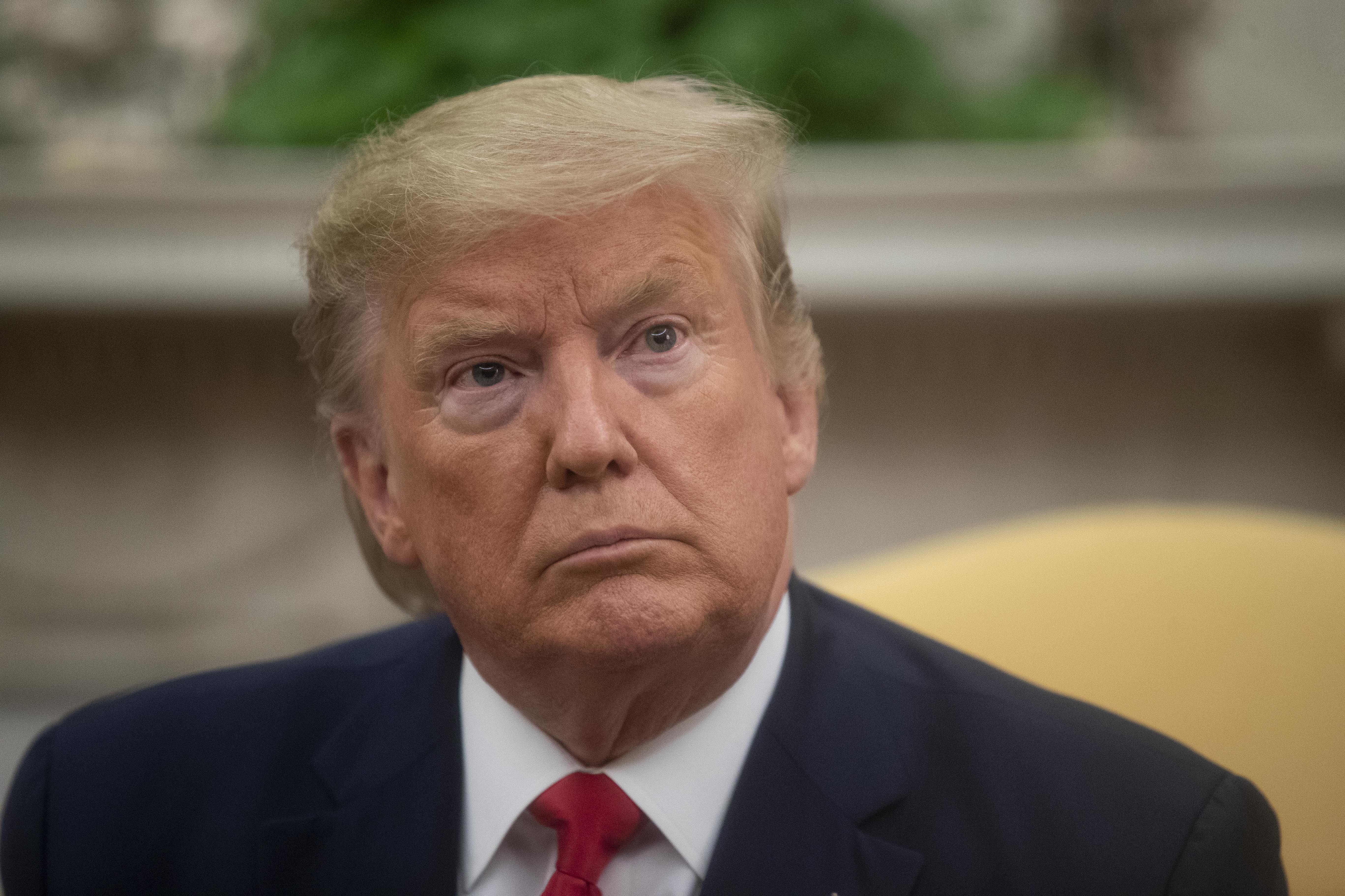 President Donald Trump listens to a question during a meeting with Greek Prime Minister Kyriakos Mitsotakis in the Oval Office of the White House, Tuesday, Jan. 7, 2020, in Washington.