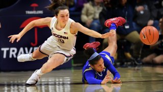 Connecticut's Molly Bent (10) goes for the ball against Tulsa's Rebecca Lescay