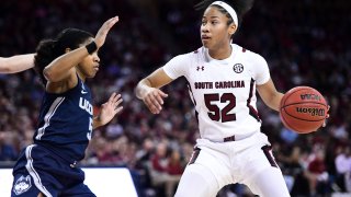 South Carolina guard Tyasha Harris (52) dribbles against Connecticut guard Crystal Dangerfield (5) during the first half of an NCAA college basketball game Monday, Feb. 10, 2020, in Columbia, S.C.