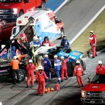 Rescue aid Ryan Newman after he was involved in a wreck on the last lap of the NASCAR Daytona 500 auto race at Daytona International Speedway, Monday, Feb. 17, 2020, in Daytona Beach, Florida. Newman had been in the lead for the last lap when another car's bumper caught his and flipped him.