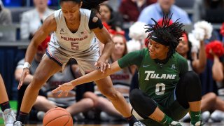 Tulane's Arsula Clark, right, is pressured by Connecticut's Crystal Dangerfield, left, in the first half of an NCAA college basketball game, Wednesday, Feb. 19, 2020, in Hartford, Conn.