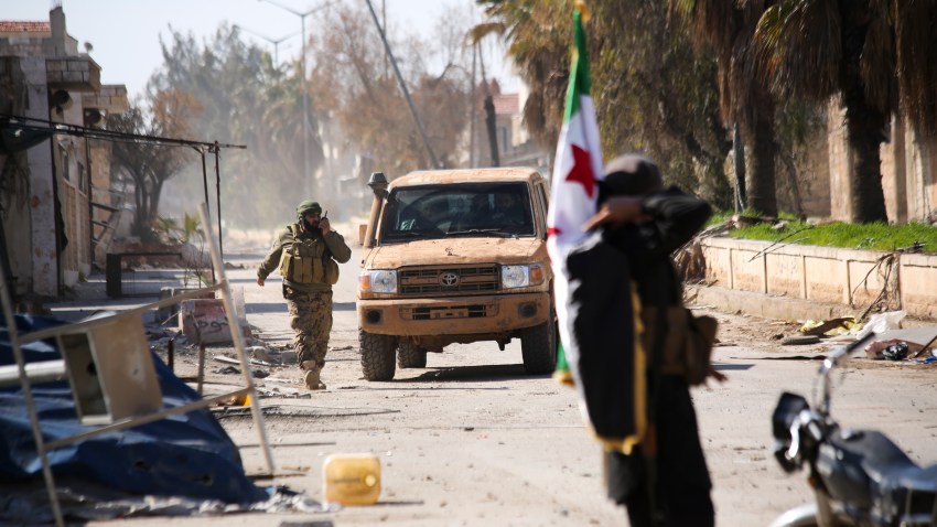 Turkish backed Syrian rebels enter the own of Saraqeb, in Idlib province, Syria, Thursday, Feb. 27, 2020.