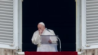 Pope Francis coughs during the Angelus noon prayer