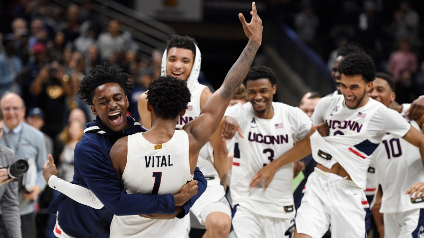 Connecticut's Temi Aiyegbusi embraces Connecticut's Christian Vital