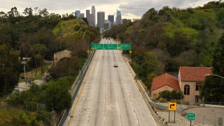 Extremely light traffic moves along the 110 Harbor Freeway toward downtown mid afternoon in Los Angeles