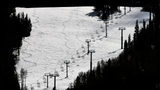 This Tuesday, March 24, 2020 photo shows ski lifts empty in Vail, Colo., after Vail Ski Resort closed for the season amid the COVID-19 pandemic.