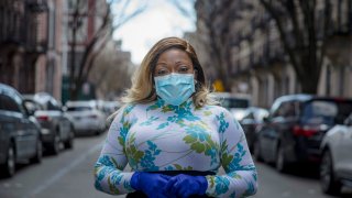 Tiffany Pinckney poses for a portrait in the Harlem neighborhood of New York on April 1, 2020. After a period of quarantine at home separated from her children, she has recovered from COVID-19. Pinckney became one of the nations first donors of "convalescent plasma." Using the blood product is experimental but scientists hope it could help treat the seriously ill and plan to test if it might offer some protection against infection for those at high risk.
