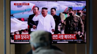 People watch a TV screen showing a news program reporting about North Korean leader Kim Jong Un with a file image at the Seoul Railway Station in Seoul, South Korea, Tuesday, April 21, 2020. The South Korean government is looking into unconfirmed reports saying North Korean leader Kim is in fragile condition after surgery.