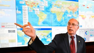 Jay Butler, deputy director for infectious diseases at the Centers for Disease Control and Prevention (CDC), speaks to the media in regards to the novel coronavirus, while standing in front of a map marked with areas having reported cases, inside the Emergency Operations Center in Atlanta.