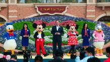 Mickey and Minnie Mouse take the stage in a reopening ceremony for Disneyland in Shanghai as the theme park reopened, Monday, May 11, 2020.