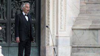 Italian tenor and opera singer Andrea Bocelli sings on a deserted Piazza del Duomo in central Milan on April 12, 2020.