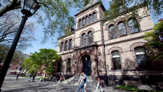 In this May 7, 2012 file photo, people walk past Sayles Hall on the campus of Brown University, in Providence, Rhode Island.