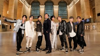 In this Feb. 24, 2020, file photo, (l-r) Jin, Jimin, and Jungkook of BTS, with host Jimmy Fallon and V, RM, SUGA, and J-Hope of BTS perform for "The Tonight Show Starring Jimmy Fallon" in Grand Central Terminal.