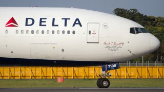 The nose of a Delta Airlines Boeing 777-200ER is seen at the Narita airport, May 6, 2017, in Tokyo.