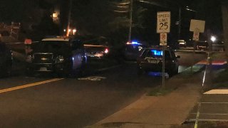 Police cruisers at the scene of a fatal stabbing in Hartford