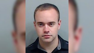 In this booking photo made available Thursday, June 18, 2020 by the Fulton County, Ga., Sheriff's Office, shows Atlanta Police Officer Garrett Rolfe. Rolfe, who fatally shot Rayshard Brooks in the back after the fleeing man pointed a stun gun in his direction, was charged with felony murder and 10 other charges. Rolfe was fired after the shooting.