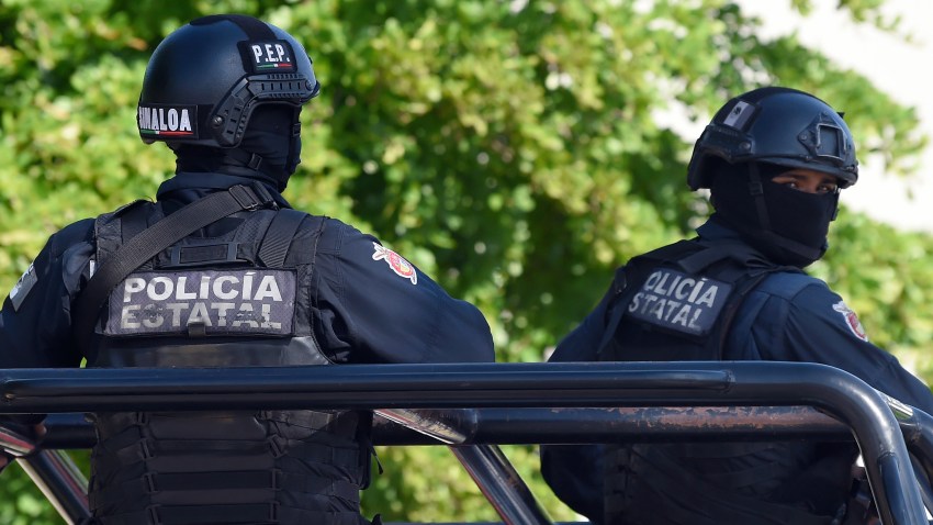 File photo - Policemen stand guard in the area where heavily armed gunmen waged an all-out battle against Mexican security forces in Culiacan, Sinaloa state, Mexico, on Oct. 18, 2019.