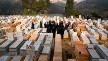 TOPSHOT - French Interior Minister Christophe Castaner visits the graves of the victims of the Ozar Hatorah school attack in Toulouse, at the Israeli cemetery of Givat Shaul in Jerusalem on January 23, 2020. - Israel is hosting world leaders and Holocaust survivors to mark 75 years since the liberation of Auschwitz, the World War II death camp where the Nazis killed more than 1.1 million people, most of them Jews. (Photo by JACK GUEZ / AFP) (Photo by JACK GUEZ/AFP via Getty Images)