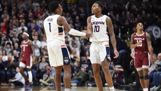 STORRS, CT – JANUARY 29: UConn Huskies guard Christian Vital (1) and UConn Huskies guard Brendan Adams (10) celebrate after a timeout is called during the game as the Temple Owls take on the UConn Huskies on January 29, 2020, at Gampel Pavilion in Storrs, Connecticut. (Photo by Williams Paul/Icon Sportswire via Getty Images)