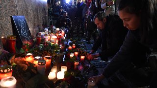 People light candles for Hanau shooting viictims