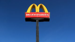 A sign in front of McDonald's