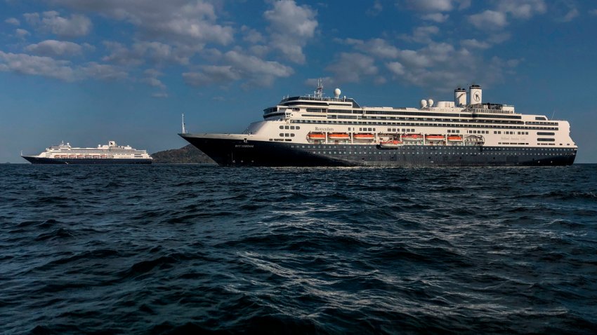 Holland America’s cruise ship Zaandam (L) and the Rotterdam cruise ship are seen in Panama City bay on March 28, 2020.