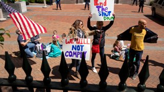 Protesters rally against stay-at-home orders related to the coronavirus pandemic outside Capitol Square in Richmond, Virginia on April 16, 2020.