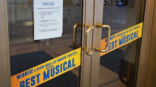 A show suspension sign in the window of Broadway's 'Come From Away'